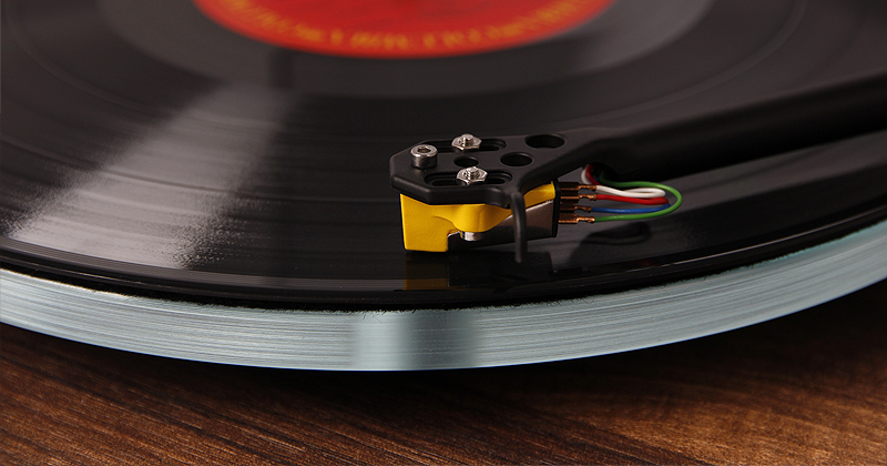 Pic showing a Rega Planar 3 turntable cartridge placed on a vinyl record
