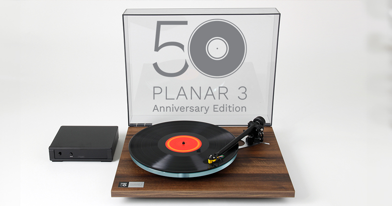 Pic showing the Rega Planar 3 turntable with the lid open and a 50th Anniversary badge in place